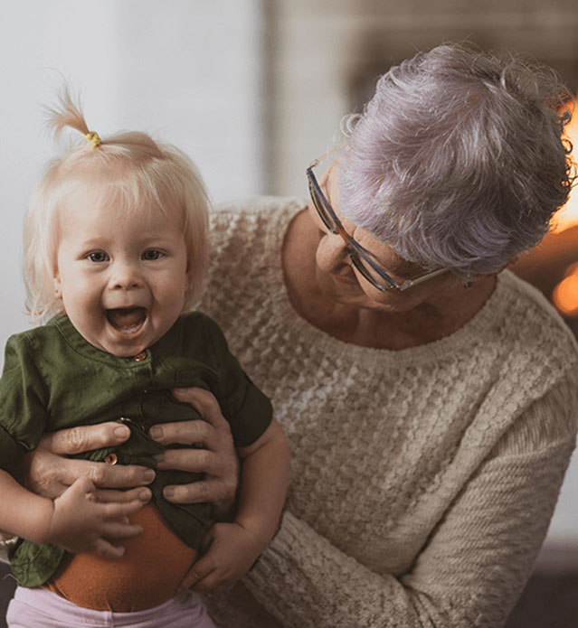 Senior woman with a younger child